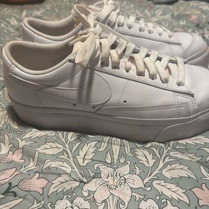 Women’s all white Nike shoes